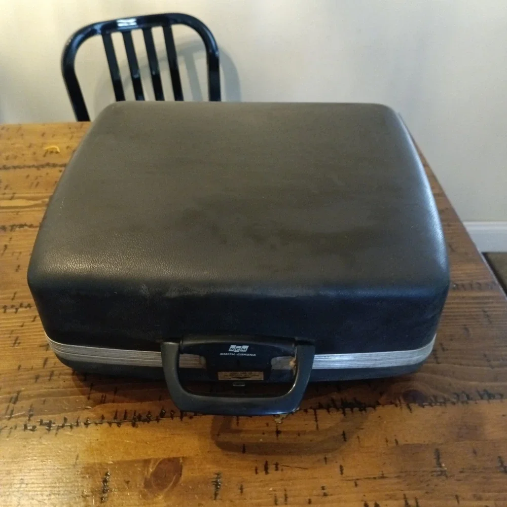 SCM Smith-Corona Super Sterling Portable Manual Typewriter with Case and Key